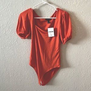 tangerine colored bodysuit